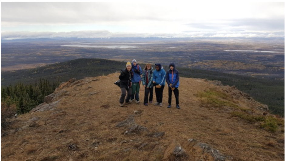 4 women standing at the top of the hill